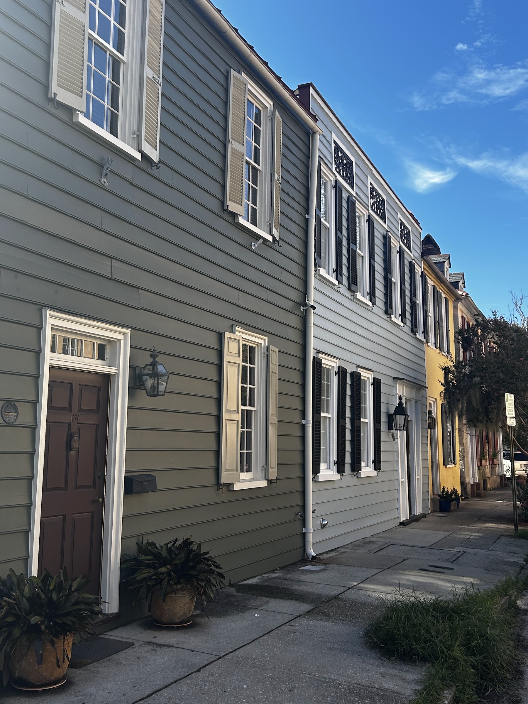 A row of colorful historic houses known as Rainbow Row in downtown Charleston.